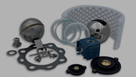 several types of spare parts on a grey background